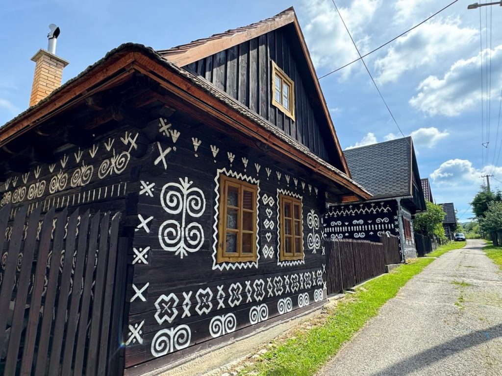 Cicmany traditional Slovak wooden village with wooden houses painted by white ornaments