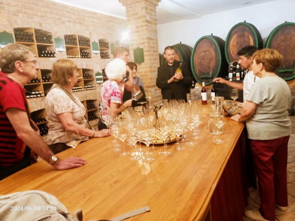 wine tasting at Vinnum gallery Bozen in pezinok, sommelier explaing the wine to the customers during Golf incentive of Slovakia