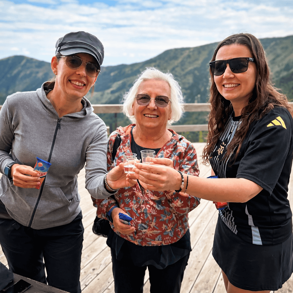 Small group tour in Slovakia – happy travelers toasting with local spirits in the Slovak mountains, active tourism and gastronomy experience by E-TRAVEL.SK DMC