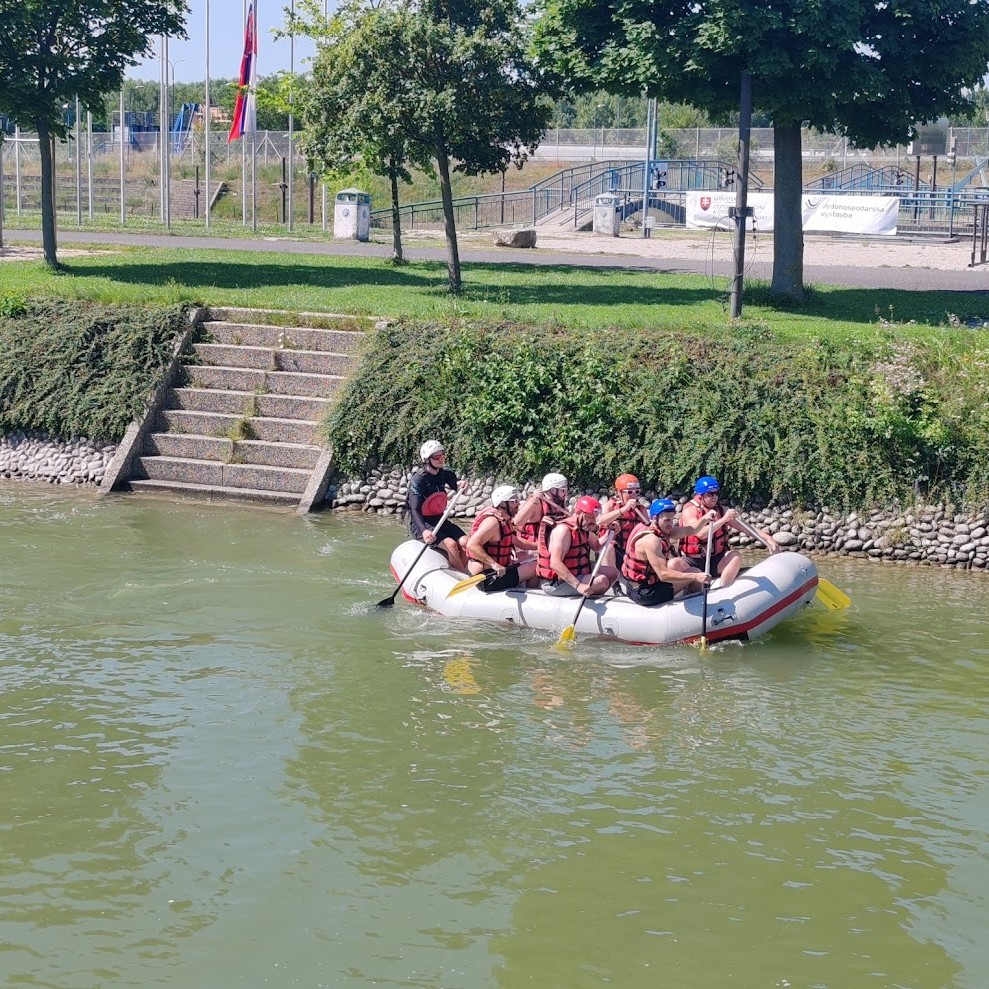 Business group rafting on the artificial white water course in Čunovo, showcasing one of the most dynamic MICE venues in Bratislava for corporate team-building events.
