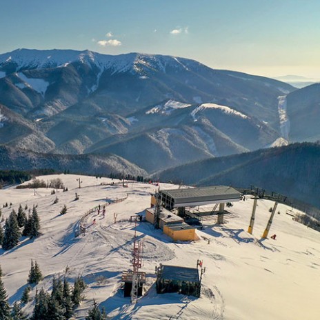 Aerial view of Donovaly ski resort in Slovakia with the Low Tatras rising behind the lift station